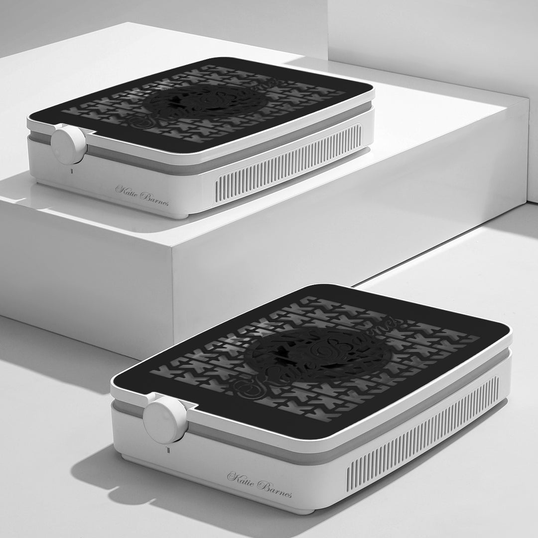 Two Katie Barnes Cordless Rechargeable Dust Collector with a white body and black grill with the Katie Barnes logo.